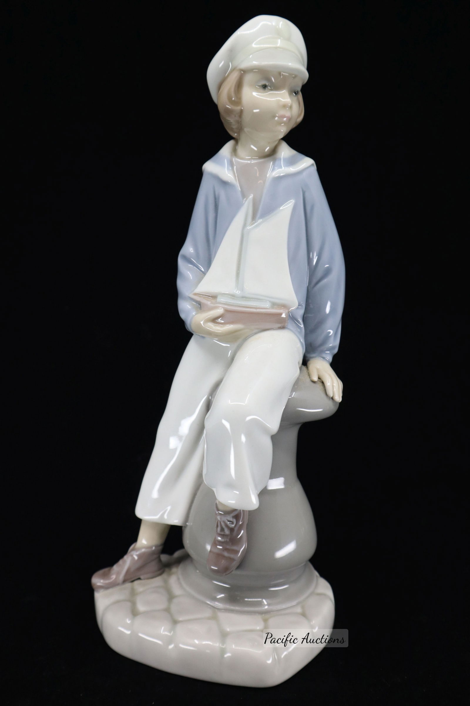 LLADRO PORCELAIN BOY WITH YACHT,