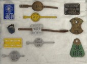 Lot (11) license plates / badg