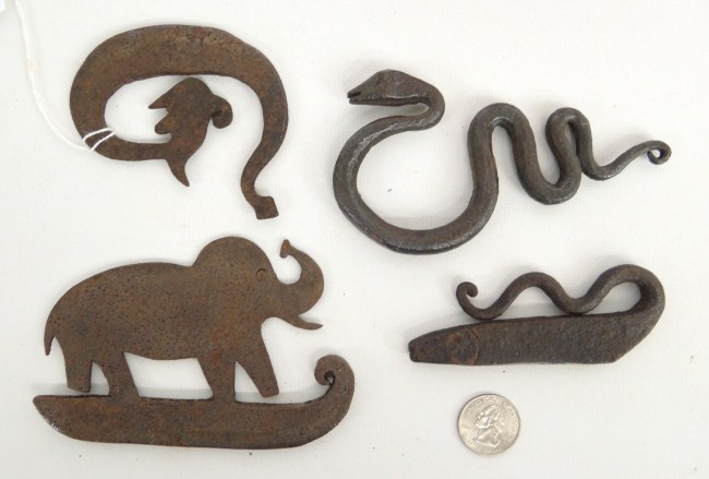 Lot four iron figural flint
