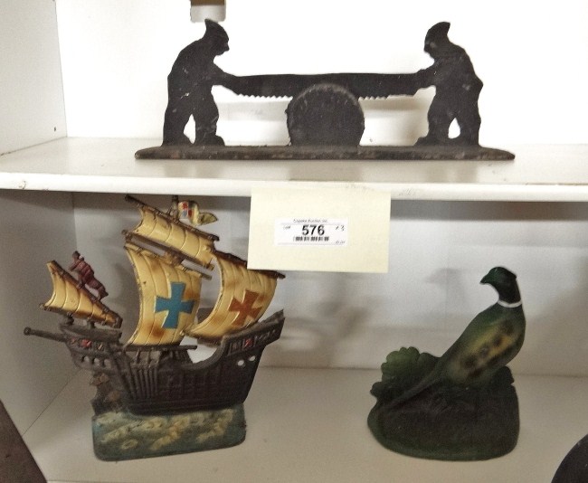 Lot including two men sawing wood