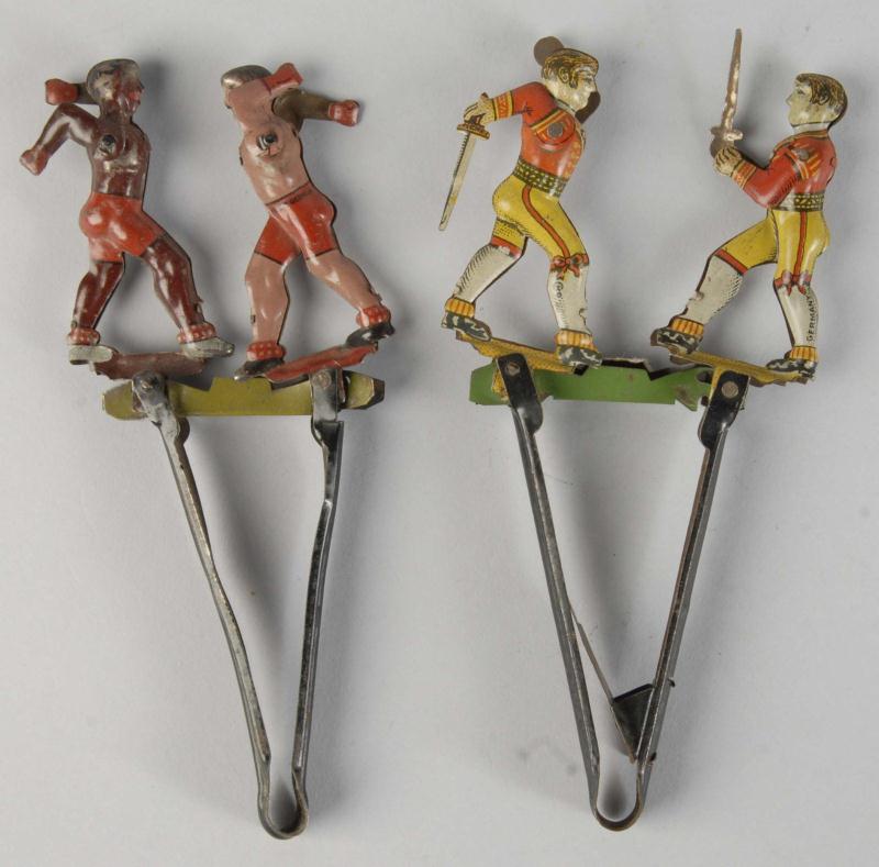 Lot of 2: Tin Litho Figural Squeeze