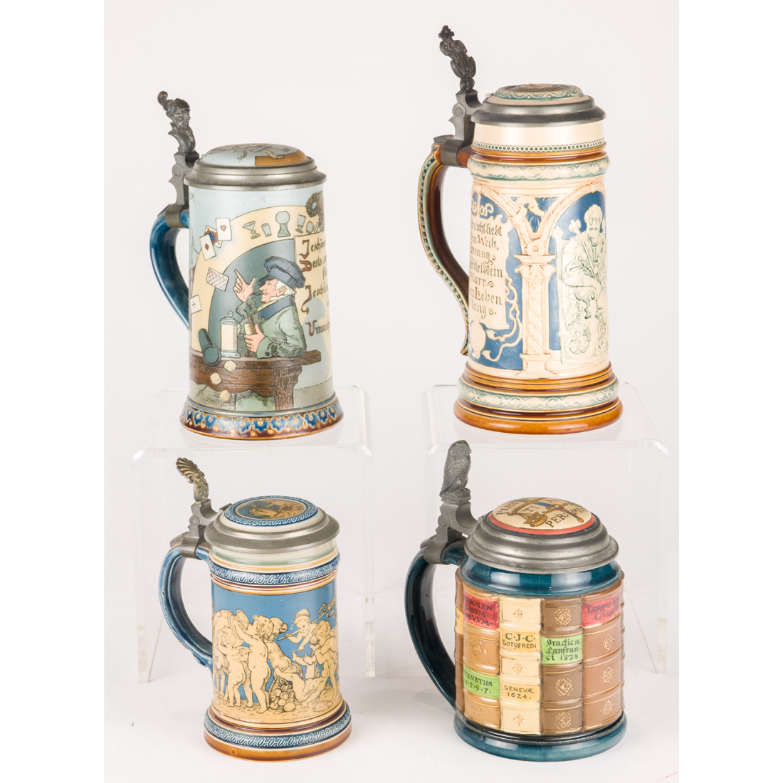 (LOT OF 4) METTLACH STEINS,