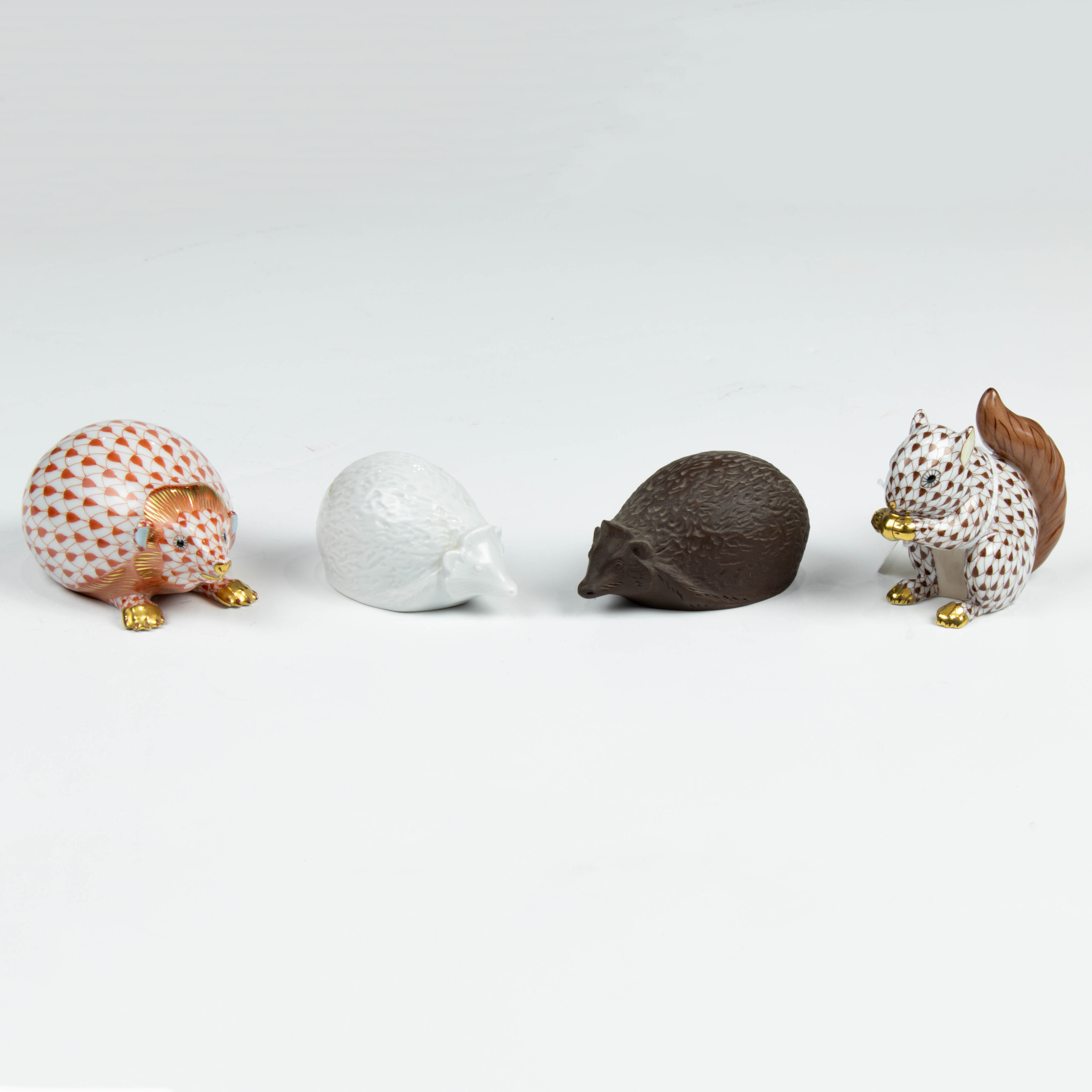 (LOT OF 4) TWO MEISSEN HEDGEHOGS