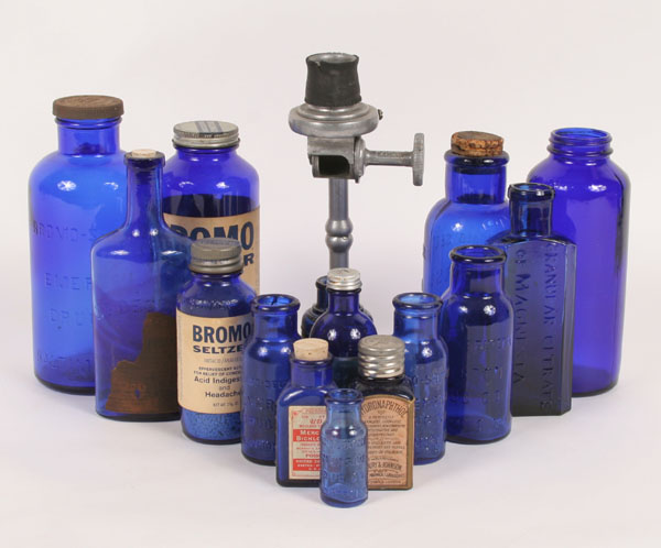 Lot of cobalt pharmacy bottles