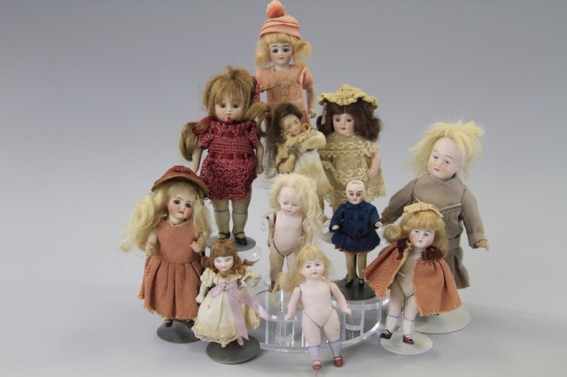 LOT OF ELEVEN ALL BISQUE DOLLS