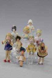 LOT OF FIVE SMALL DOLLS AND FI