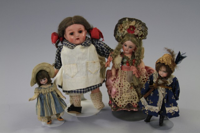 LOT OF FOUR SMALL DOLLS Largest