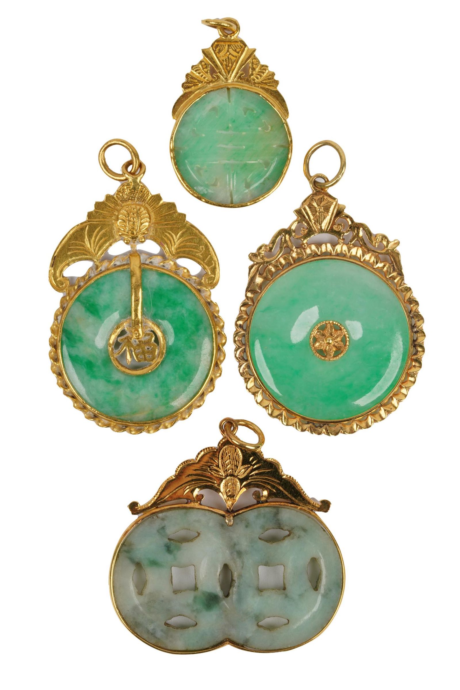 LOT OF FOUR YELLOW GOLD & JADE DISC