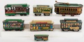 LOT OF SEVEN TIN TROLLEY TOYS.