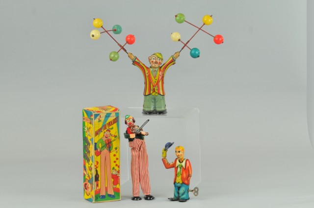 LOT OF TIN CLOWN TOYS Three