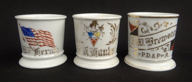 Lot three painted shaving mugs
