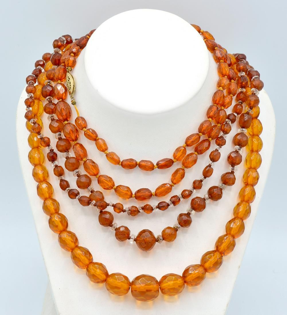 LOT: THREE STRANDS OF FACETED AMBER
