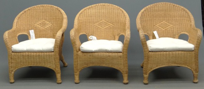 Lot three wicker porch chairs.