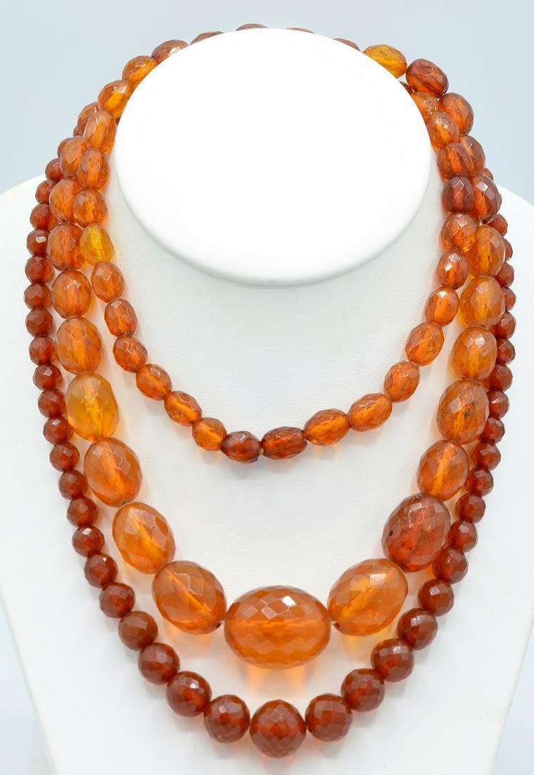 LOT: TWO STRANDS OF FACETED AMBER