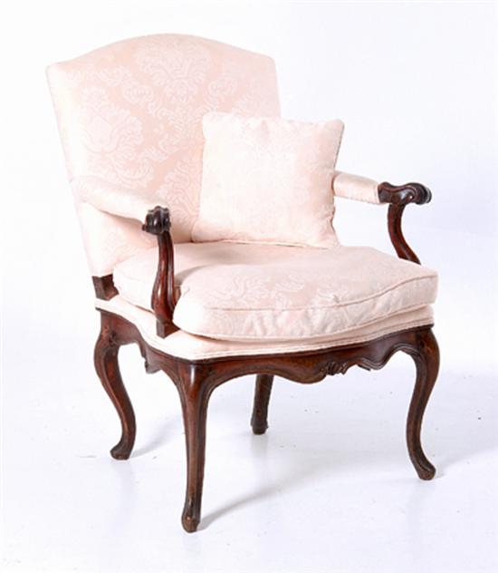Louis XV carved fruitwood bergere