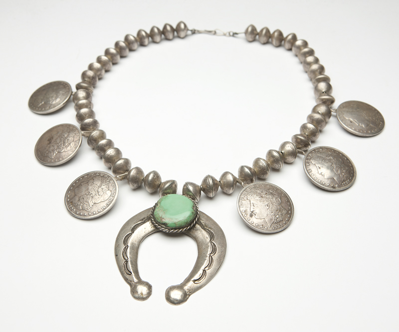 Made from hammered U.S. ten cent
