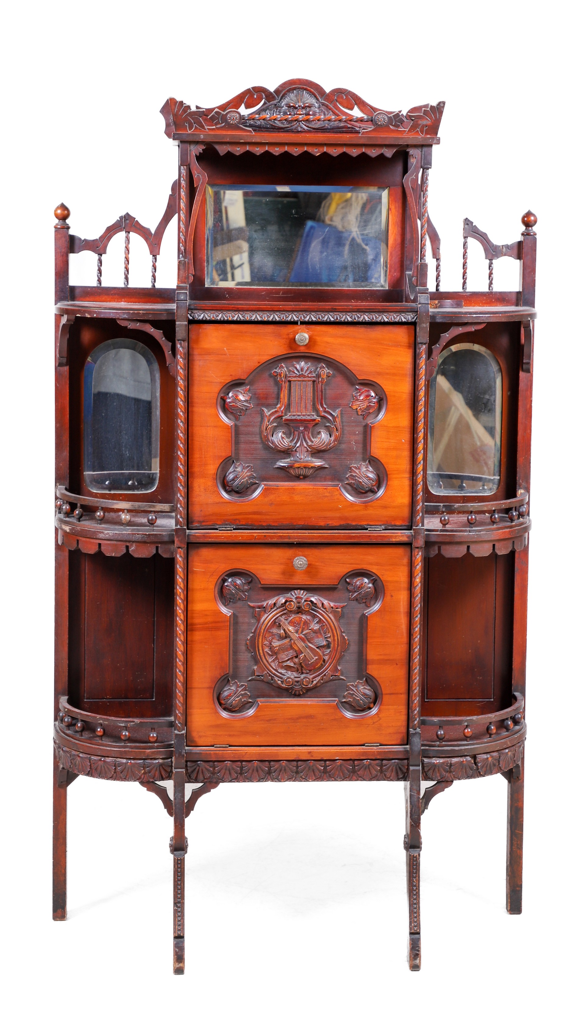 Mahogany music cabinet, crest