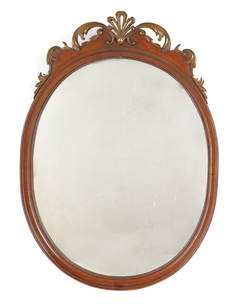 Mahogany oval mirror 20th c. with a