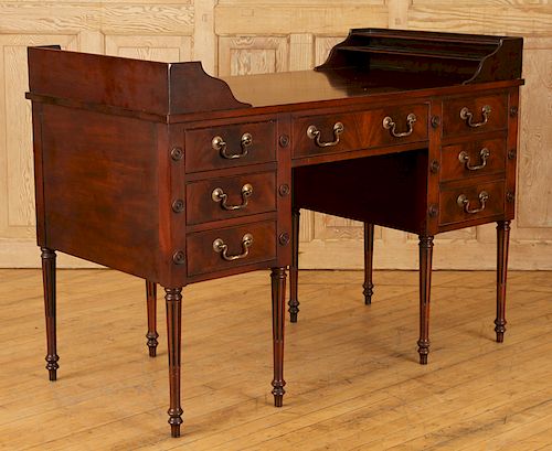 MAHOGANY SEVEN DRAWER WRITING DESKA