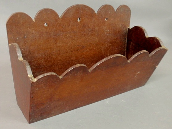 Mahogany wall pocket with scalloped