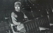 MAN SEATED IN BALLPARK STADIUM