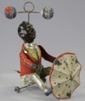 MAN TWIRLING BALLS AND UMBRELL