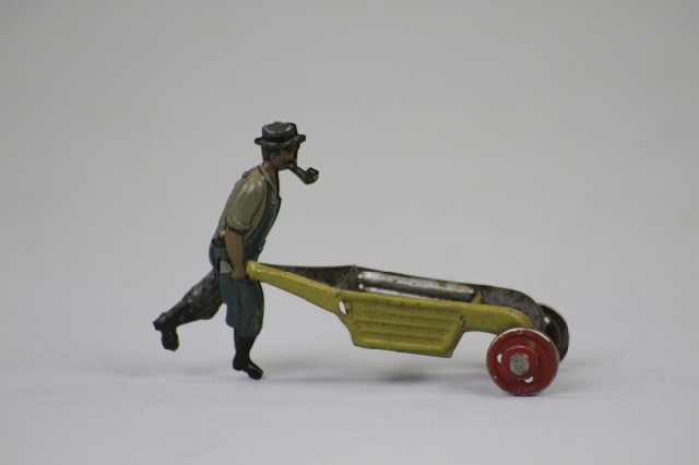 MAN WITH PIPE AND WHEELBARROW PENNY