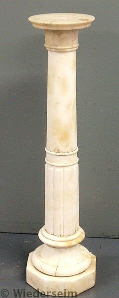Marble pedestal with a round