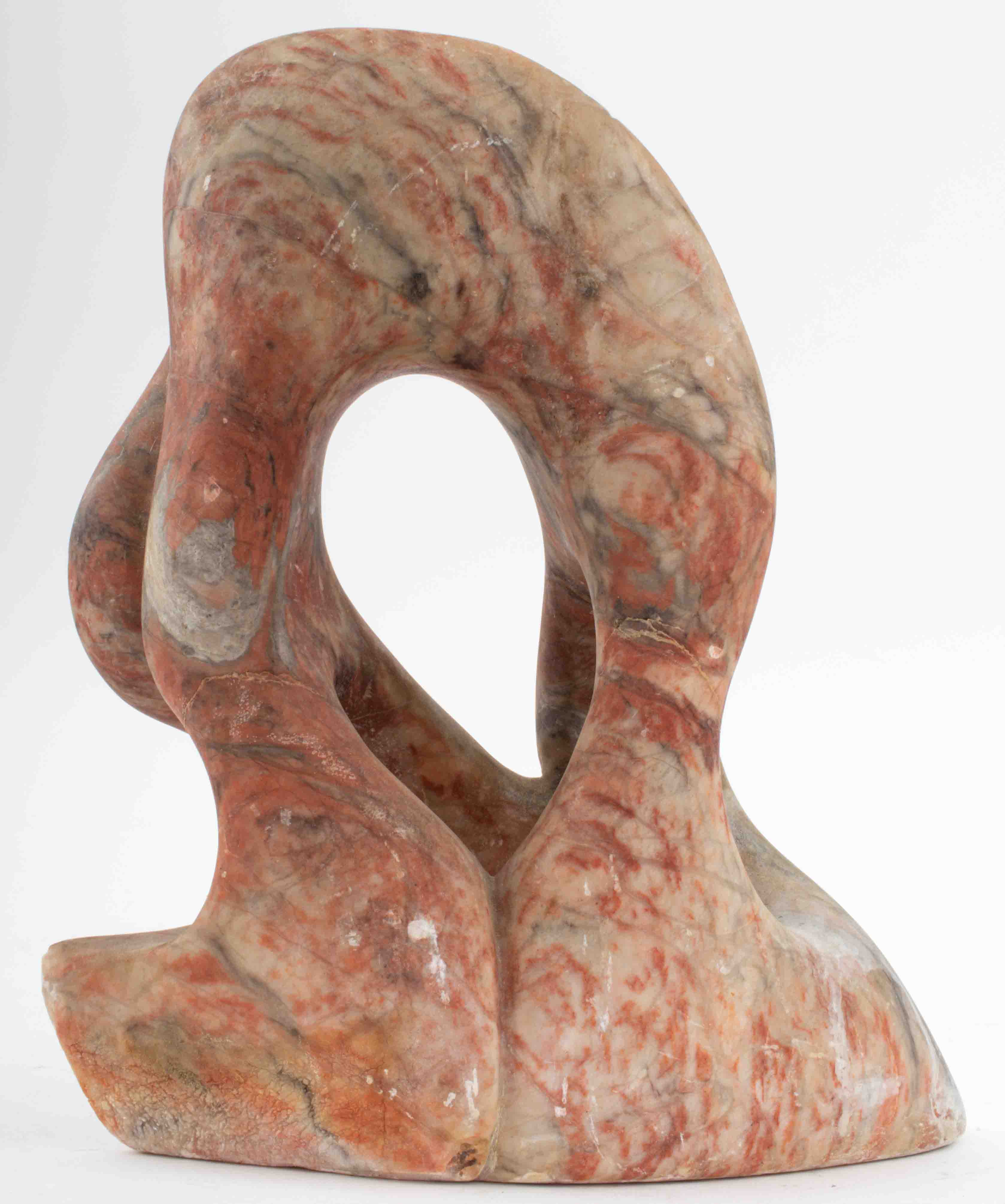 MARBLED RED STONE CARVED ABSTRACT