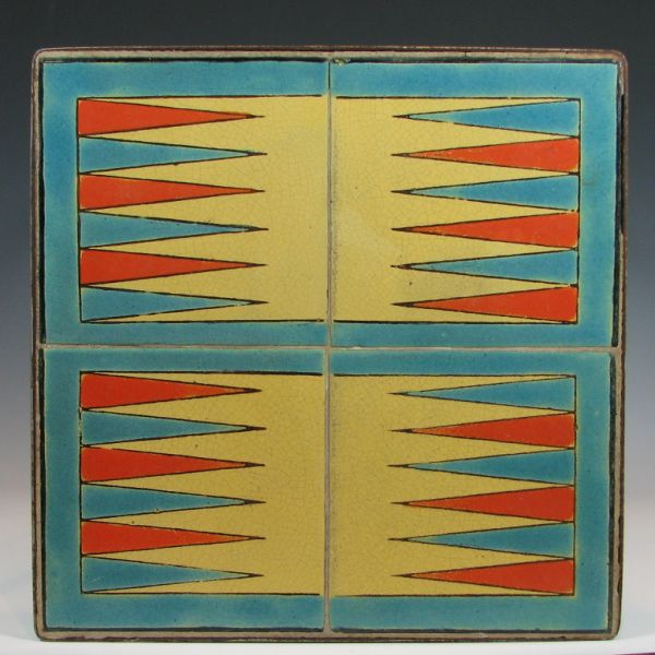 Metal table with four art pottery