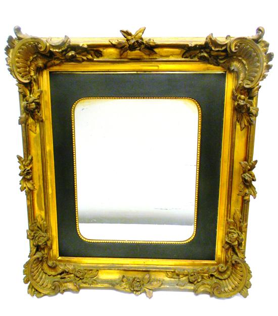 Mirror in elaborate gold frame 