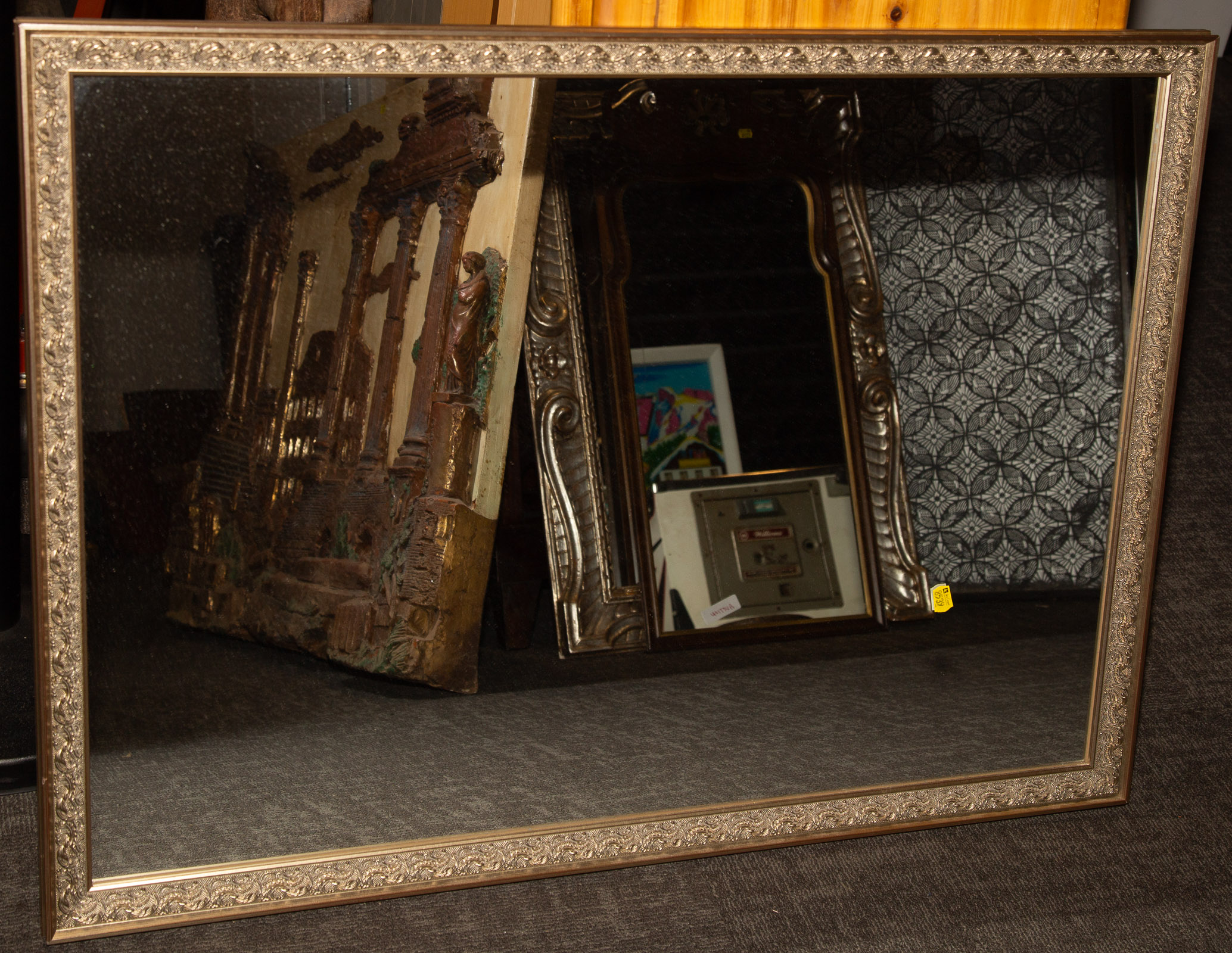 MIRROR IN MOLDED SILVER-GILT