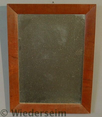 Mirror with a mahogany veneered