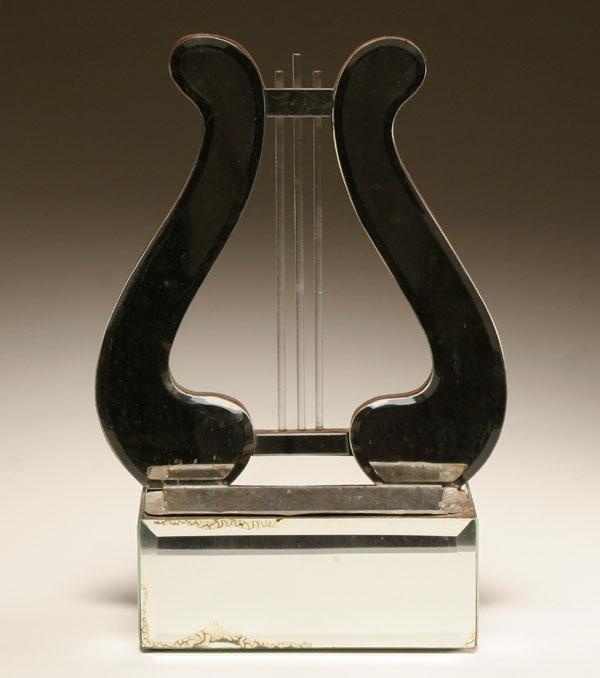 Mirrored lyre form wall planter