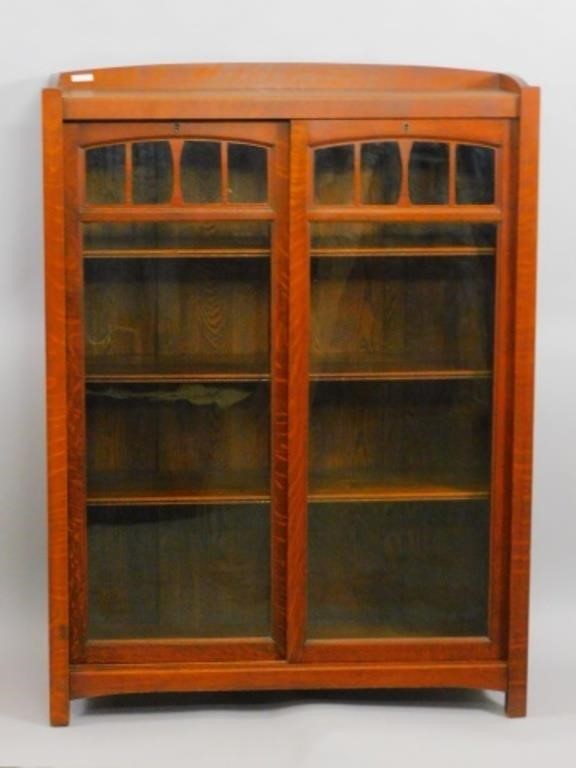 MISSION OAK BOOKCASE. (2) SLIDING
