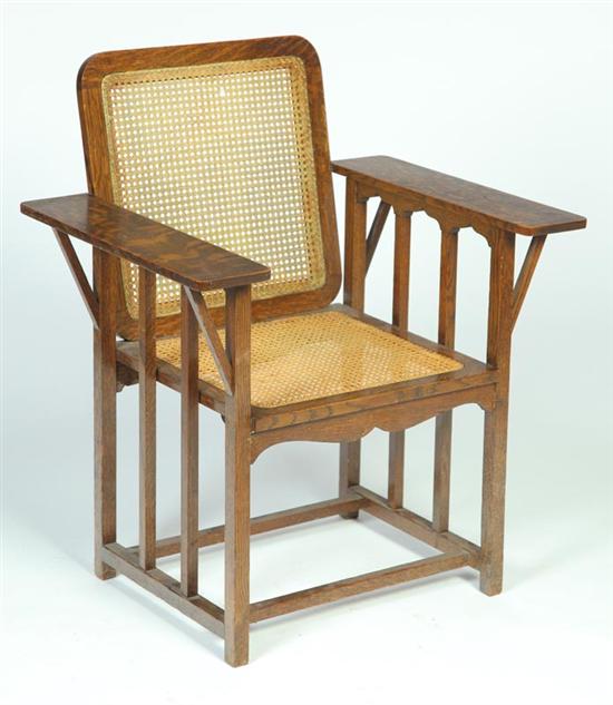 MISSION OAK CANED ARM CHAIR. 