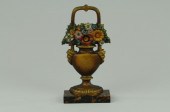 MIXED FLOWERS IN URN DOORSTOP