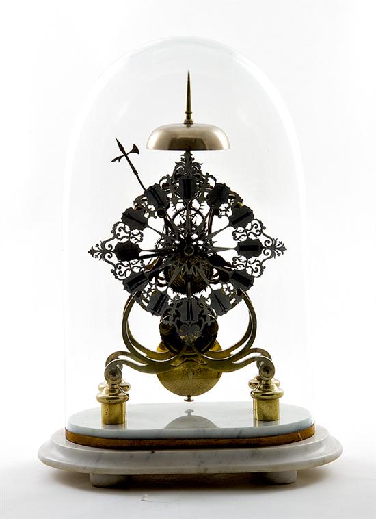 Modern brass skeleton clock under