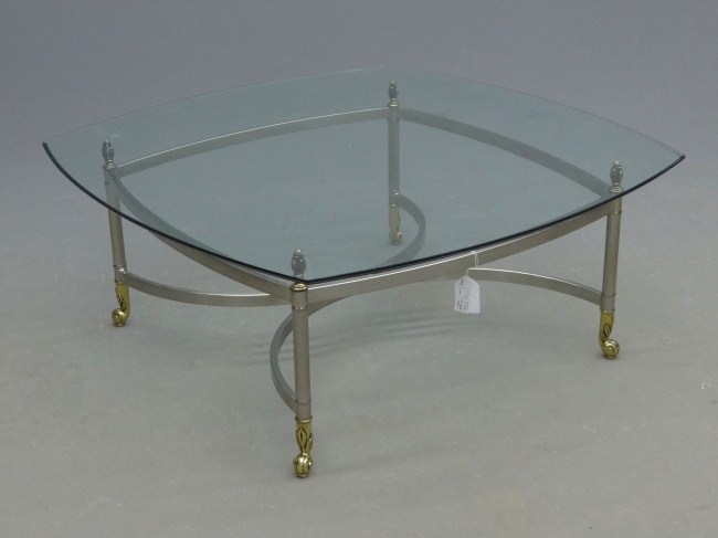 Modern coffee table with glass top.