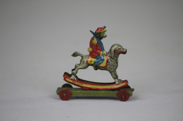 MONKEY ON ROCKING DOG PENNY TOY