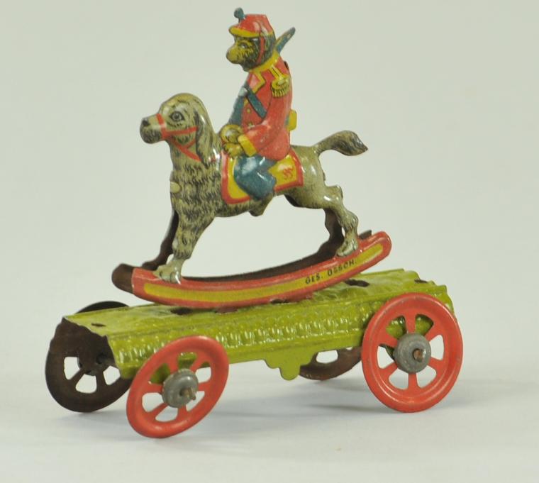 MONKEY ON ROCKING DOG PENNY TOY