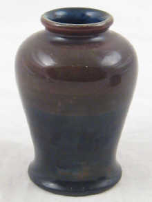 Moorcroft. A small vase dark