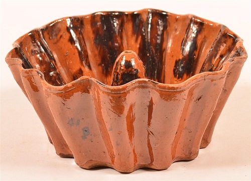 MOTTLE GLAZED REDWARE SCALLOP