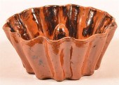 MOTTLE GLAZED REDWARE SCALLOP
