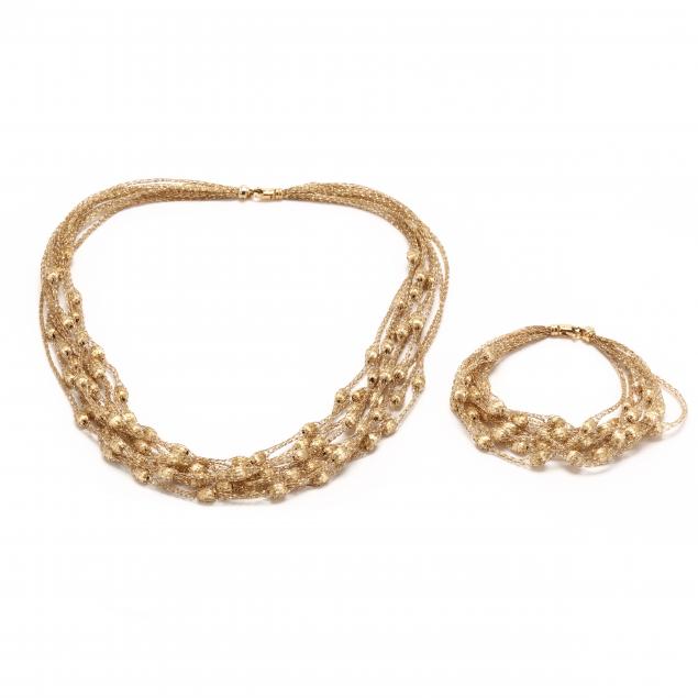 MULTI-STRAND GOLD BEAD NECKLACE AND
