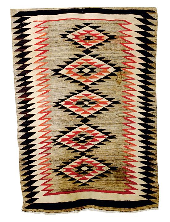 Navajo weaving serrated diamonds on