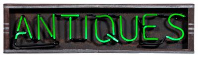 Neon "Antiques" sign, green