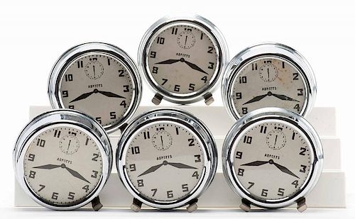 NEST OF ALARM CLOCKS. COLON: