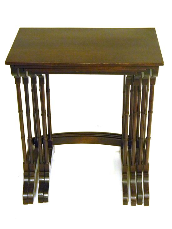 Nest of four mahogany stands 