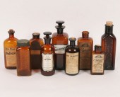 Nine amber glass medicine bott